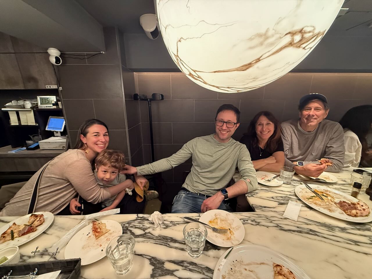The family eating pizza at Savoy